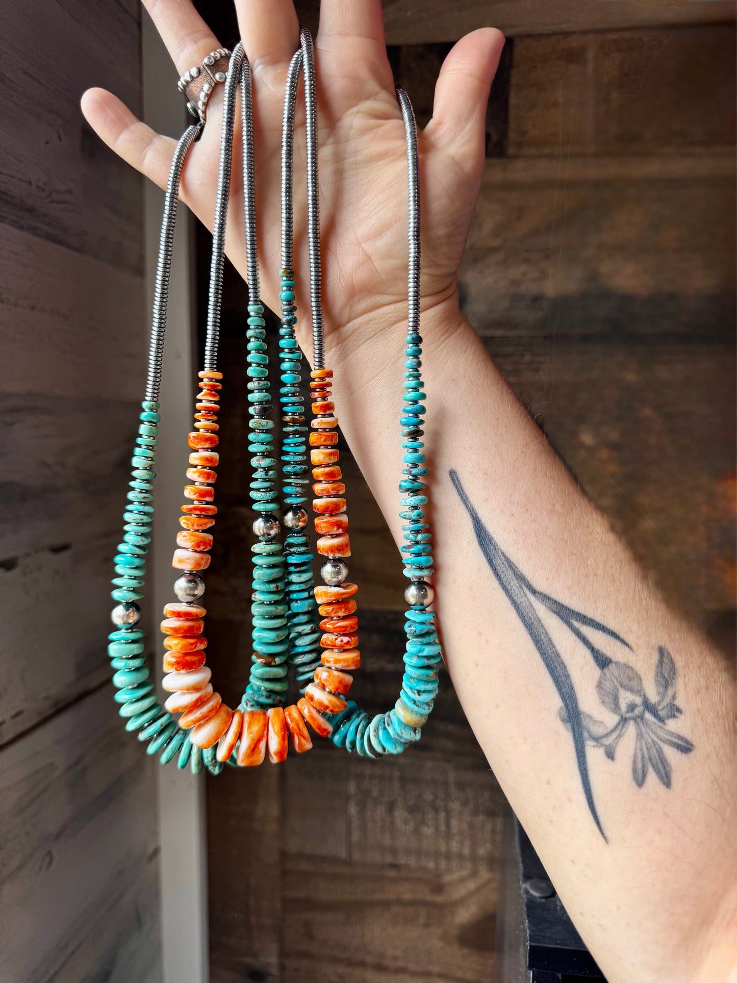 22 inch graduated orange spiny necklace with Sterling silver pearls