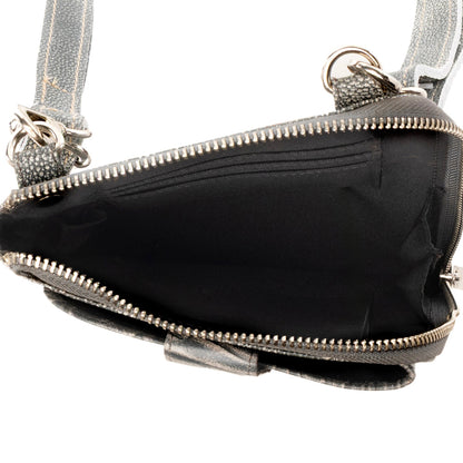 Myra Coyote Bloom Embossed mini sling for Women in sage with floral detail